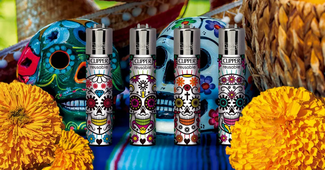 Colorful Clipper lighters with Day of the Dead designs displayed with marigolds and decorative skulls